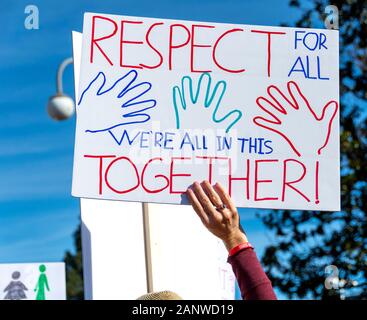 Close-up of a hand-drawn sign proclaiming, 'Respect for All. We're All in this Together!' Women's March 2020 in Orange County, California. Stock Photo