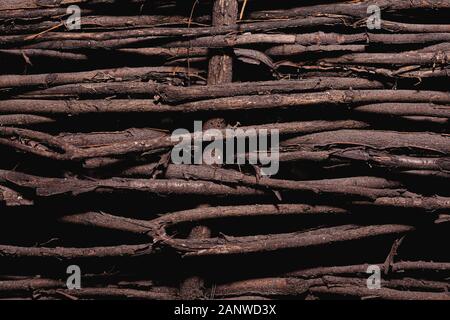 Wicker fence made of knots. Stock photo fence background. Stock Photo