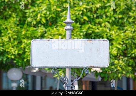 Old blank metal town name plate sign in Italy Stock Photo