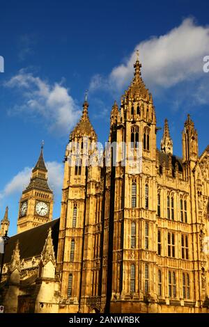 Towers overlooking Old Palace Yard, Big Ben clock tower in left background, Palace of Westminster / Houses of Parliament, London, England Stock Photo