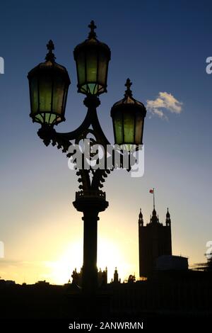 Ornate street lamp on Westminster Bridge, Victoria tower and Palace of Westminster / Houses of Parliament in background, London, England Stock Photo