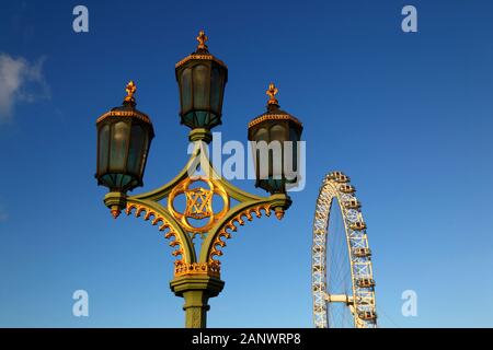 Ornate street lamp on Westminster Bridge and London Eye / Millennium Wheel, London, England Stock Photo