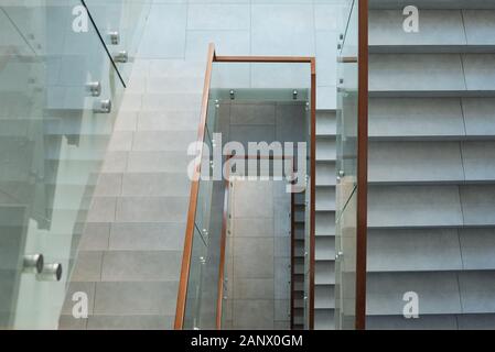 Top view of white marble staircases that is part of business center interior Stock Photo