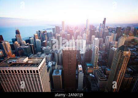 Streets and tall skyscrapers of Chicago panoramic view from above at evening sunset time, Illinois USA Stock Photo