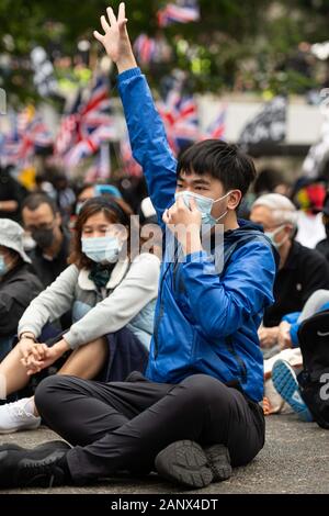 Hong Kong. January 18, 2020, Hong Kong, Hong Kong, Hong Kong, China: What started as a peaceful demonstration in Chater Garden, quickly eroded into chaos. Protesters Began their march east toward Causeway Bay, chanting there demands. Shortly after their march began they were soon confronted by a wall of police. Within minutes the peaceful march exploded into mayhem. Police blanketed the area with tear gas, dividing the crowd and sending protesters scattering. Credit: ZUMA Press, Inc./Alamy Live News Stock Photo