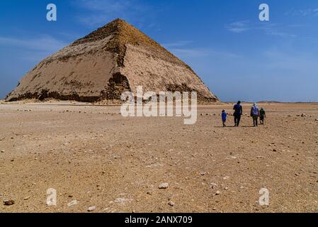 The Bent Pyramid is an ancient Egyptian pyramid located at the royal necropolis of Dahshur, approximately 40 kilometres south of Cairo, built under th Stock Photo