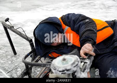 Portrait of a worker repairing equipment in extreme conditions Stock Photo