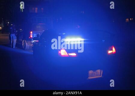 Detroit police Special Ops officers stop a vehicle at night and speak with the driver, Detroit, Michigan, USA Stock Photo