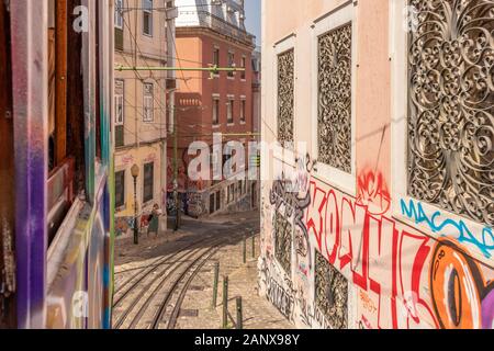 Lisbon Portugal - July 22, 2019: View down the steep hill from the Elevador da Glória funicular in Bairro Alto, Lisbon City Centre, Portugal. Stock Photo