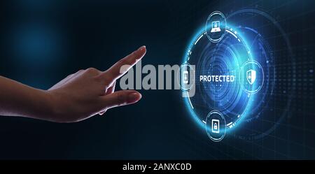 Business, technology, internet and networking concept. Young businessman select the icon Protected on the virtual display. Stock Photo