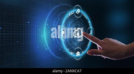 Cloud computing concept. Business, technology, internet and networking concept. Young businessman select the icon Cloud on the virtual display. Stock Photo