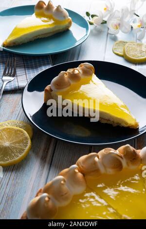 Slices of lemon pie on a wooden table Stock Photo