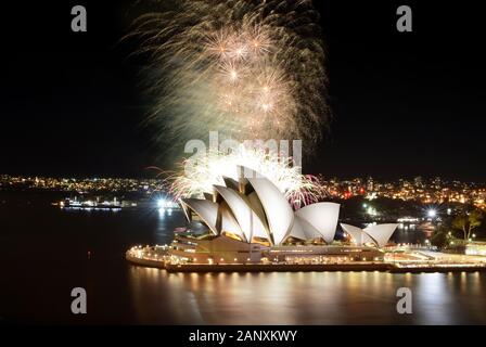 SYDNEY, AUSTRALIA - MARCH 8, 2018 - A huge fireworks show finale rains down over the Sydney Opera House against the backdrop of the city Stock Photo