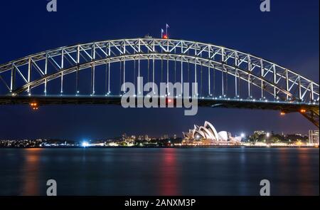 Long exposure of Sydney Harbour Bridge at night against a deep blue sky Stock Photo