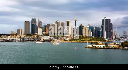 Wide panoramic view across the harbor of Sydney's iconic city skyline and downtown central business district in Australia Stock Photo