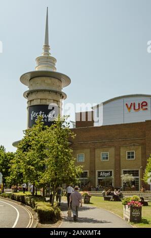 Basingstoke, UK - July 23, 2019:  Pedestrians enjoying the sunshine outside the landmark Festival Place shopping centre in Basingstoke, Hampshire. The Stock Photo