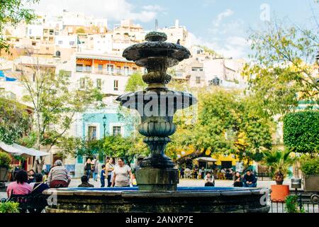 Guanajuato, Mexico-November 2019 the stone fountain in the Plaza del Baratillo, on a sunny day, Stock Photo