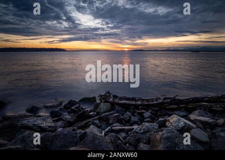 Sunset, Puget Sound. November sunset over Elliot Bay. Elliot Bay is part of the Puget Sound on the pacific northwest coast of the United States.  The Stock Photo