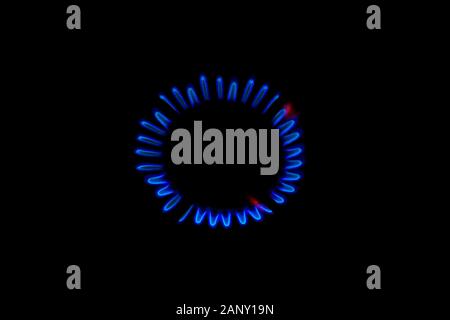 blue flame of a burning burner in the dark background. Stock Photo