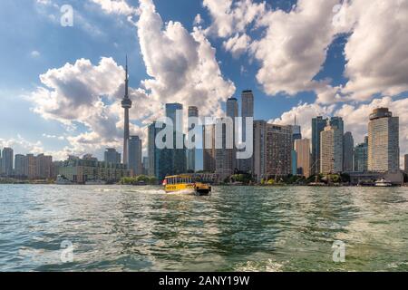 Toronto city skyline and water taxi in Ontario Lake, Toronto, Ontario, Canada. Stock Photo