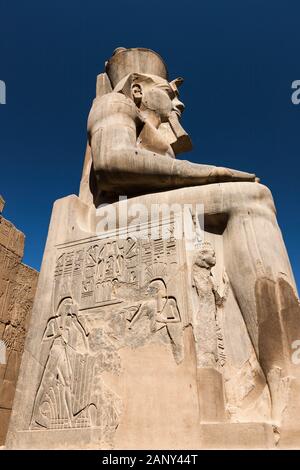 Huge statue and scuiptures and relief of Ramesses II, Ramses II  phylon, Luxor Temple, Luxor, Egypt, North Africa, Africa Stock Photo