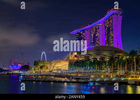 Singapore - September 06, 2019: View of the illuminated famous luxury hotel, shopping center and casino Marina Bay Sands after sunset Stock Photo
