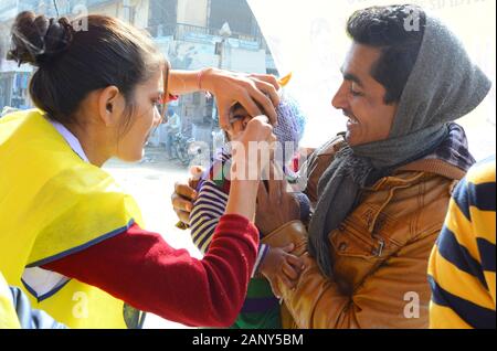 India. 19th Jan, 2020. A child being administered pulse polio vaccine drops by ANM worker during the National Immunization Day 'Polio Ravivar' in Beawar. (Photo by Sumit Saraswat/Pacific Press) Credit: Pacific Press Agency/Alamy Live News Stock Photo