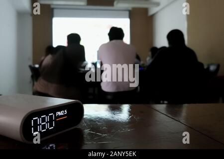bad indoor air quality in study room. classroom air quality measuring. pm2.5 (particulate matter) small dust detector state over acceptable standard o Stock Photo