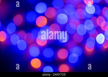 Bright defocused colorful lighs shining in dark Stock Photo