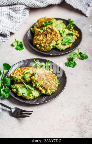 Broccoli Pancakes With Fresh Parsley On Red Plate Stock Photo - Alamy