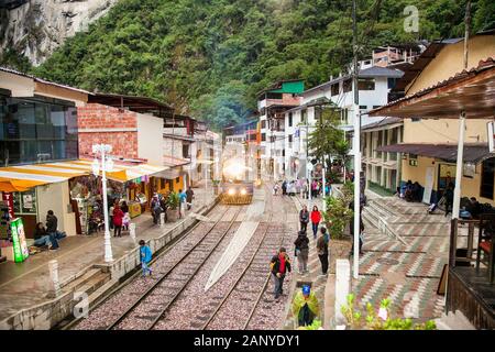 Machu Picchu Pueblo,  Peru - Jan 7, 2019: The Train arriving at Aguas Calientes town, the closest access point to the archaeological site of Machu Pic Stock Photo