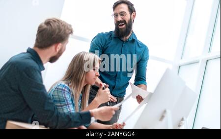 smiling employees checking financial statements . business concept Stock Photo
