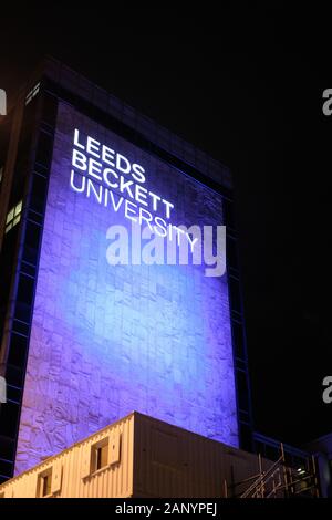 LEEDS, UNITED KINGDOM - Jan 11, 2020: Leeds Beckett University buildings entrance lite up in blue at night Stock Photo