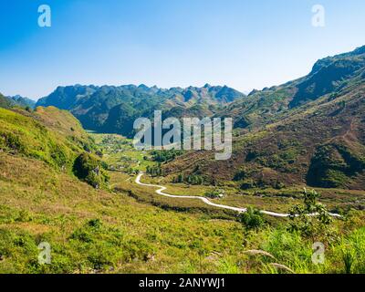 Ha Giang karst geopark mountain landscape in North Vietnam. Winding road in stunning scenery. Ha Giang motorbike loop, famous travel destination biker Stock Photo