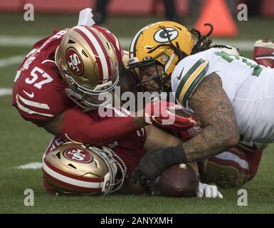 Green Bay Packers offensive tackle Billy Turner (R) grabs an Aaron Rodgers fumble from San Francisco 49ers defensive end Nick Bosa (bottom) and linebacker Dre Greenlaw (57) in the second quarter of the NFC Championship at Levi's Stadium in Santa Clara, California on Sunday, January 19, 2020.    Photo by Terry Schmitt/UPI Stock Photo