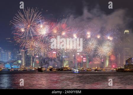 Hong Kong - October 01. 2018 - Fireworks for the Chinese National Day,  Panoramic view from Tsim Sha Tsui Promenade towards Hong Kong Island. Stock Photo