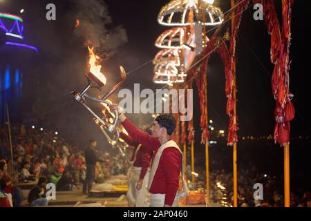 Priest celebrating the river Ganges Aarti by offering incense, Dashashwamedh Ghat, Varanasi, Uttar Pradesh, India Stock Photo
