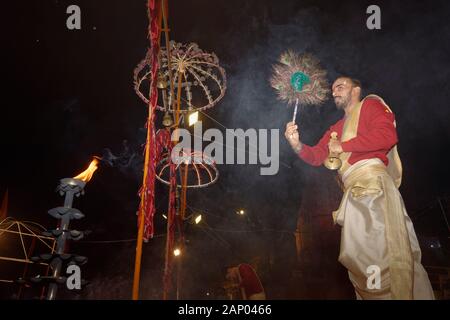 Priest celebrating the river Ganges Aarti by offering incense, Dashashwamedh Ghat, Varanasi, Uttar Pradesh, India Stock Photo