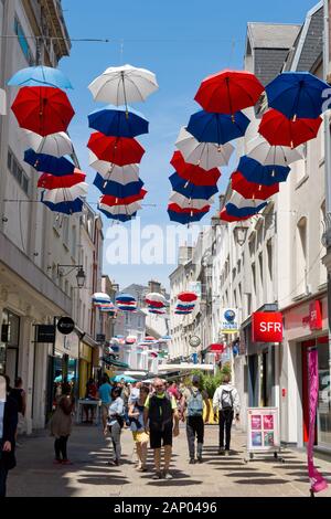 Mulit coloured hanging umbrellas as street decoration in Cherbourg. Stock Photo