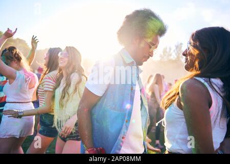Enthusiastic crowd dancing at music festival Stock Photo