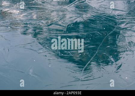 reflections on the ice structure of a frozen lake Stock Photo - Alamy