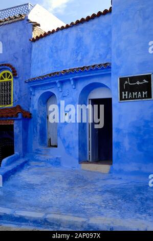 Traditional Blue Architecture & Entrance to Blue Hamam in the Medina or Old Town Chefchaouen or Chaouen Morocco Stock Photo