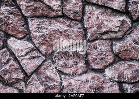 Old stone wall. Rock brown background. Interior decoration. Vintage stone texture. Abstract structure. Grunge paper wallpaper Stock Photo