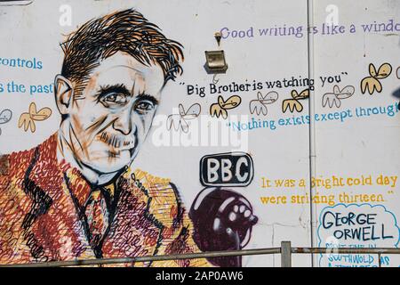 Painting of George Orwell on Southwold Pier. Stock Photo