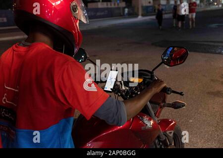 Employee in a fast food restaurant delivers food on a scooter, delivery service, American street food, fast food, snack bar, on October 2nd, 2019 World Athletics Championships 2019 in Doha/Qatar, from September 27th. - 10.10.2019. Â | usage worldwide Stock Photo