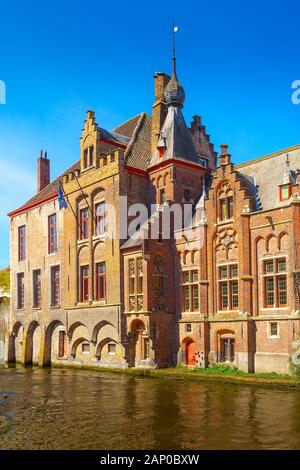 Bruges, Belgium medieval ancient houses made of bricks at water canal in old town Stock Photo