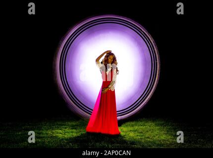 HIGH CONTRAST VIVID COLOUR ABSTRACT BACKGROUND CREATED BY LIGHT PAINTING -SCIENCE FICTION, DYNAMIC MOVEMENT,ARTISTIC MERIT WITH MANAKIN Stock Photo