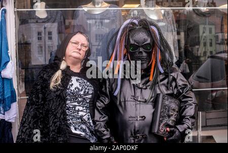 Couple in traditional Goth costumes at the Whitby Goth Weekend Festival in Whitby in North Yorkshire. Stock Photo