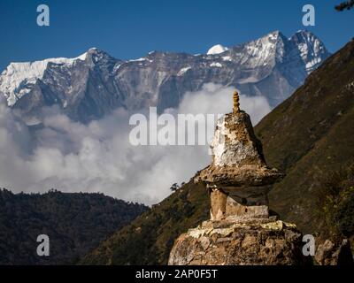 Stupa, valley and mountains in the Himalayan area in Nepal Stock Photo