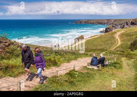Walkers on the South West Coast path at Carnewas and Bedruthan Steps on the North Cornwall coast. Stock Photo
